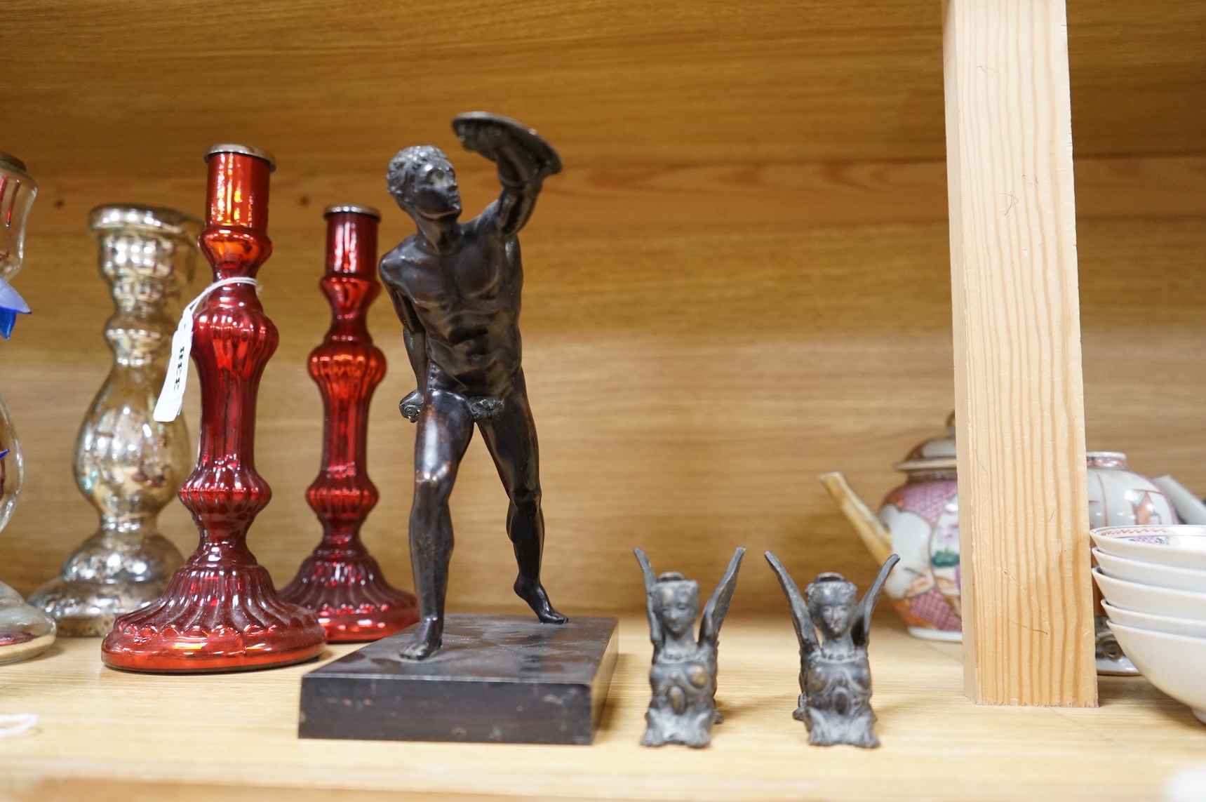 After the antique, a bronze figure of a warrior and two small studies of sphinx, largest 21cm high